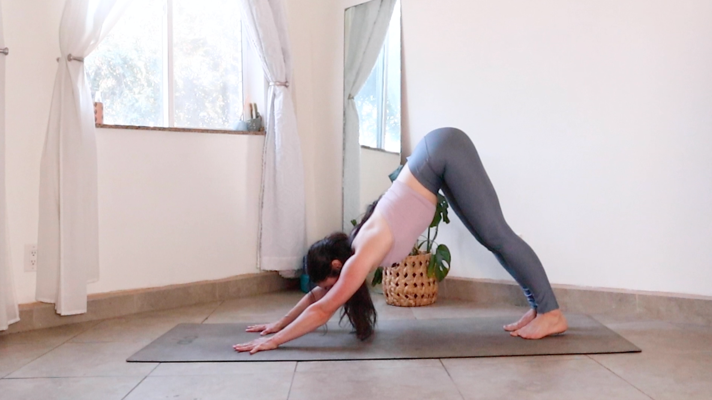 Teacher Daria LeGrand in Downward-Facing Dog